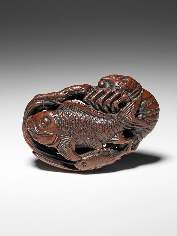Carved model of a group of fish